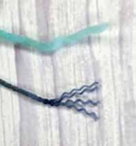 a strand of single ply yarn showing no separate strands with a 4ply yarn showing the 4 individual plys